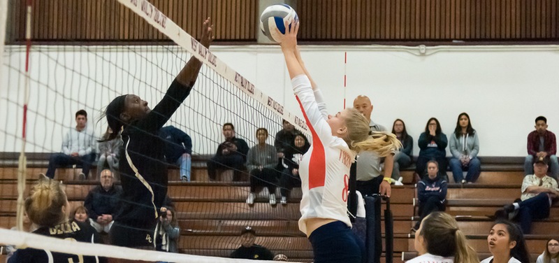 Kaylin Henderson goes up for a solo block against Delta