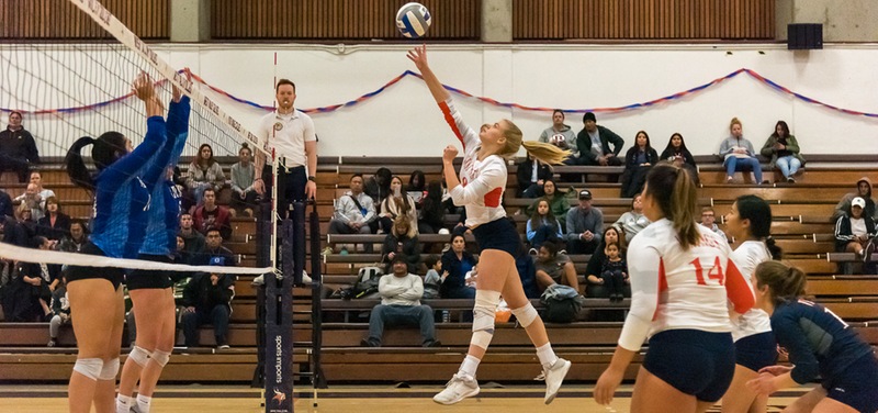 Kaylin Henderson swings on one of her match-high 19 kills against San Mateo